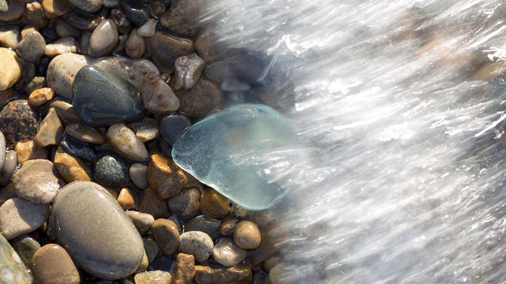 Beach glass and stones on the beach.
